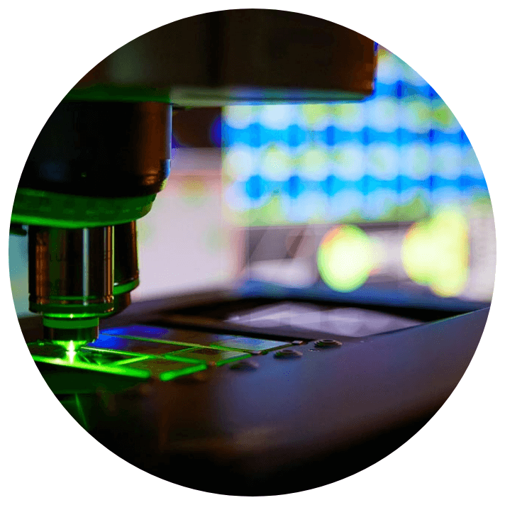A microscope in the dark performing FISH testing