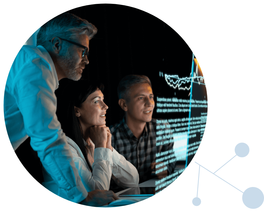 Scientists looking at data on a screen